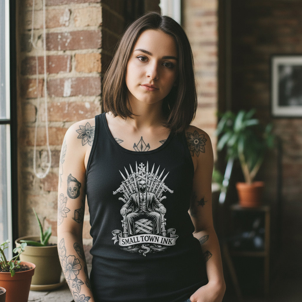 Black tank top with a graphic design of a skeleton on a throne and 'Small Town Ink' text.